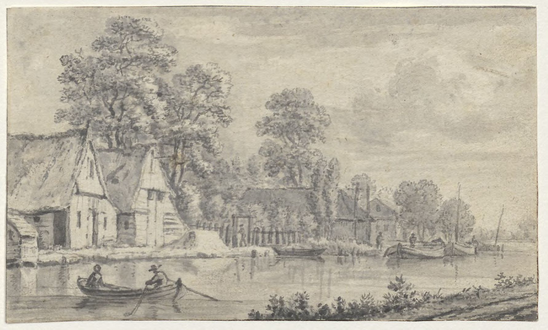Farm buildings alongside a river